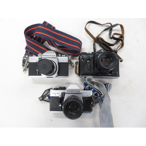 224 - 3x SLR film cameras including Zenith and Practika with lenses working - not tested