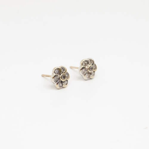 30 - Pair of 9ct gold and diamond flower earrings  1.2g