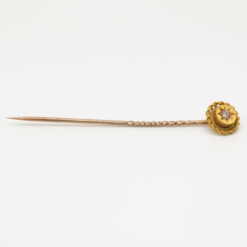 42 - 15ct gold and diamond pin head with 9ct gold pin shaft  1.2g