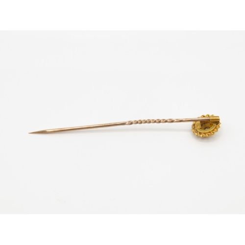 42 - 15ct gold and diamond pin head with 9ct gold pin shaft  1.2g