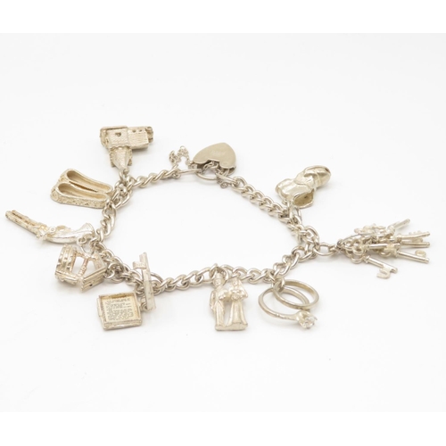 53 - Silver charm bracelet 36.4g