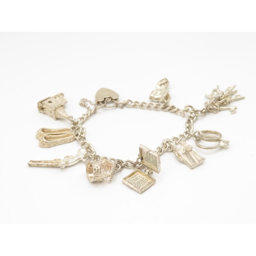 53 - Silver charm bracelet 36.4g