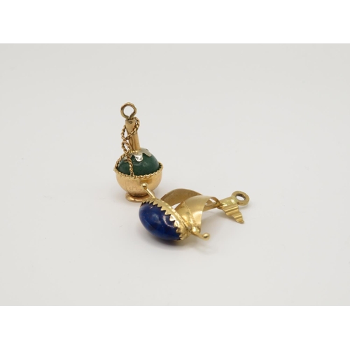 63 - 2x 18ct gold charms 1x with lapiz lazuli insert and 1x with green stone inserts 6.6g