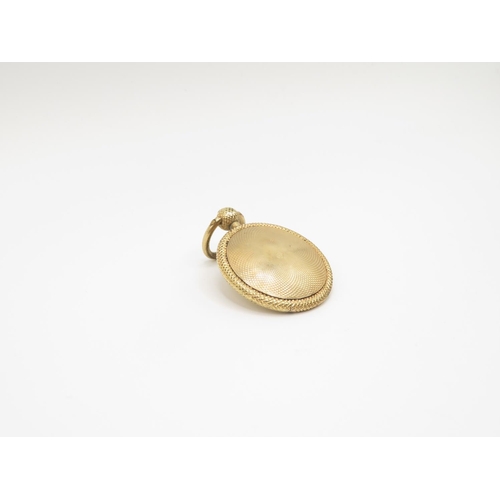 67 - 9ct gold locket containing plaited hair with spring opening catch 30mm diameter  9g