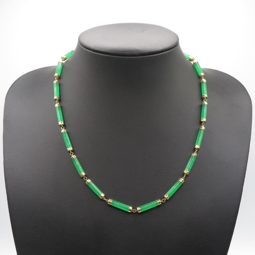 74 - 14ct gold green stone necklace  22cm long with pair of 14ct green stone drop earrings  30mm drop  18... 