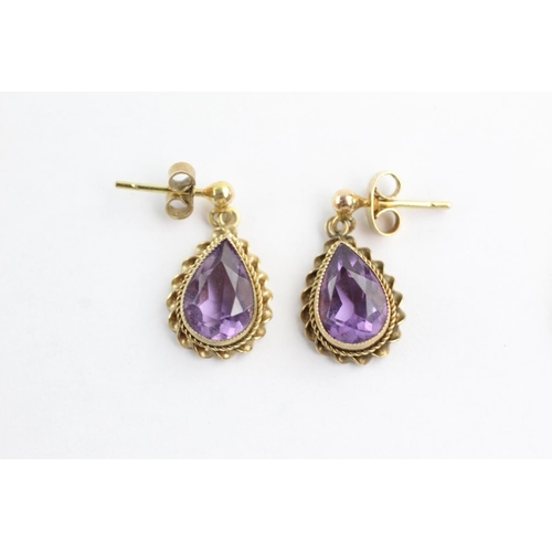 102 - 2 x 9ct gold paired amethyst earrings and pendants (3.8g)