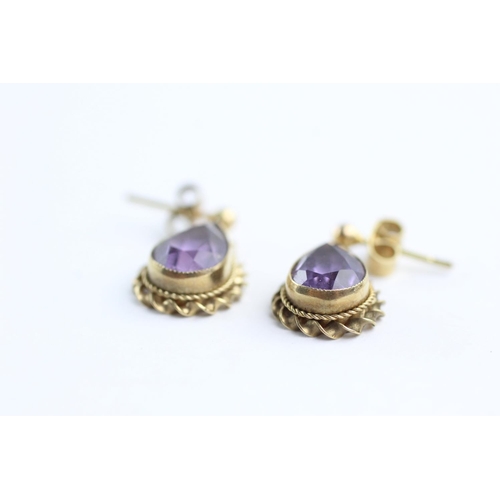 102 - 2 x 9ct gold paired amethyst earrings and pendants (3.8g)