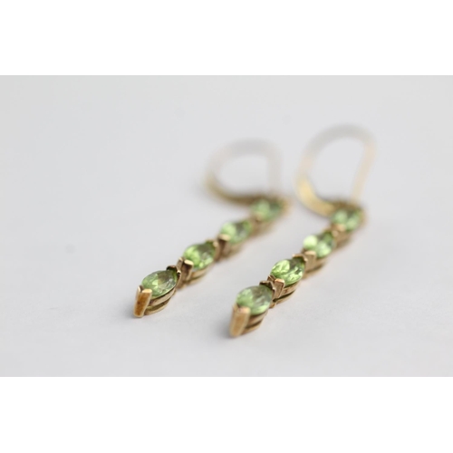 128 - 9ct gold peridot drop earrings (2.2g)