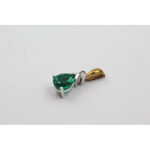 144 - 9ct gold diamond and synthetic emerald pendant (1.1g)