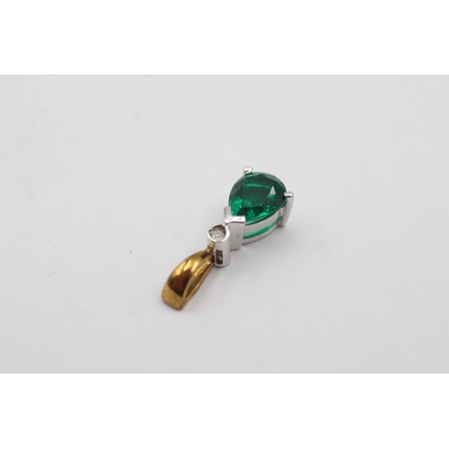 144 - 9ct gold diamond and synthetic emerald pendant (1.1g)