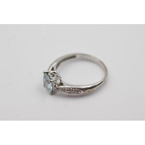 167 - 9ct white gold topaz & diamond dress ring (2.2g) Size O