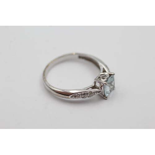 167 - 9ct white gold topaz & diamond dress ring (2.2g) Size O