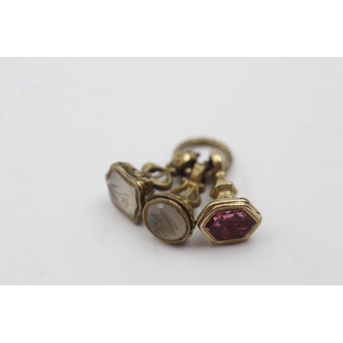 217 - 3 x 6ct antique seal fobs on a split ring including amethyst, chalcedony, insect, ship (4.2g)