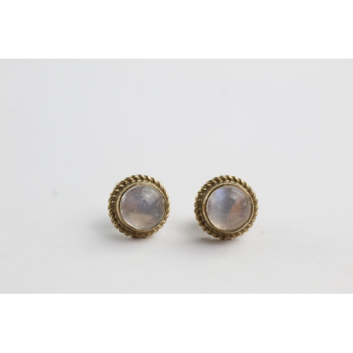 218 - 9ct gold moonstone rope framed stud earrings (1.3g)