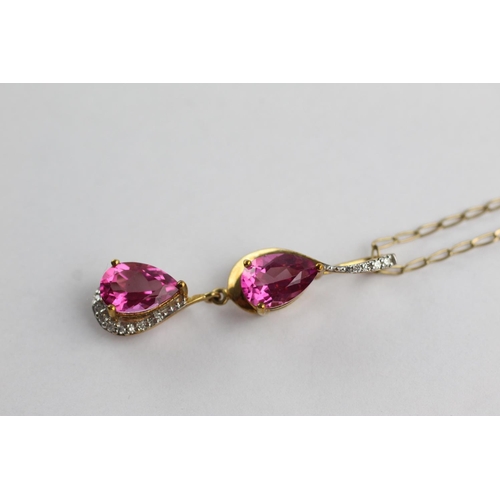 223 - 9ct gold diamond & pink gemstone drop pendant necklace (3.8g)