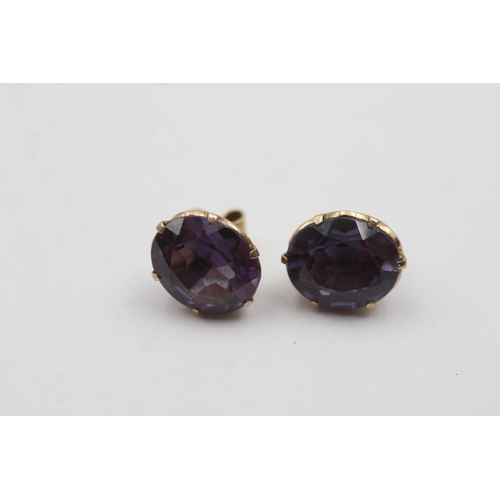 228 - 9ct gold synthetic colour change sapphire stud earrings (4.5g)