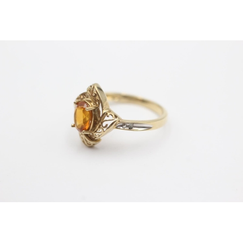 261 - 9ct gold swirl framed citrine ring (2.4g) Size N