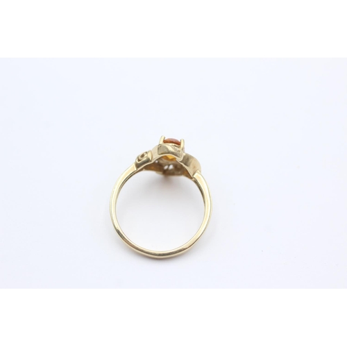 261 - 9ct gold swirl framed citrine ring (2.4g) Size N