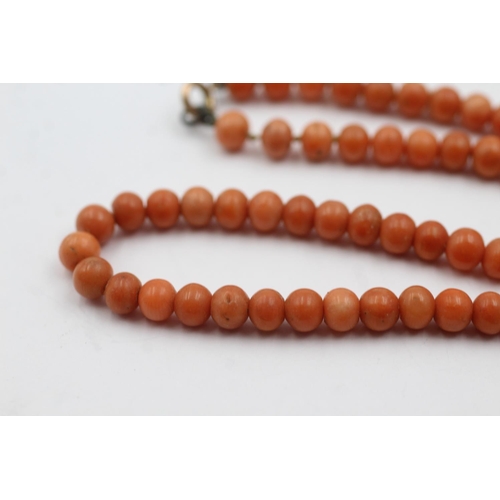 264 - 9ct gold clasped antique coral bead necklace (13.8g)