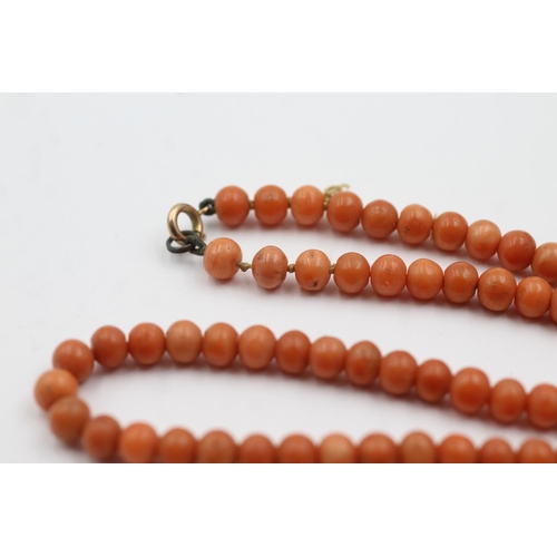 264 - 9ct gold clasped antique coral bead necklace (13.8g)