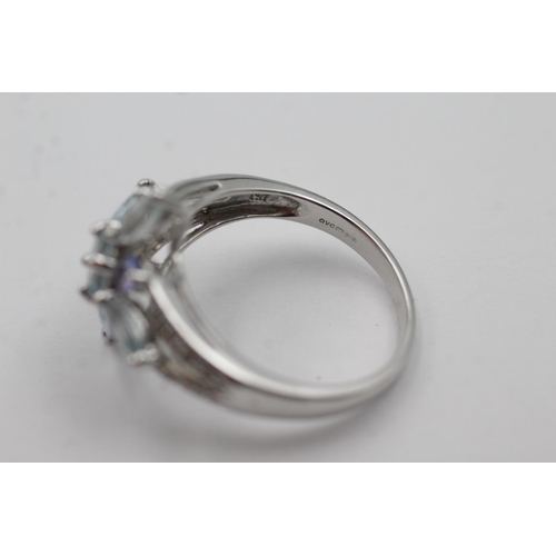 267 - 9ct white gold diamond, tanzanite & aquamarine ring (4.2g) Size R