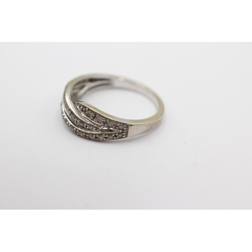 32 - 9ct white gold diamond twist band ring (3.8g) Size N