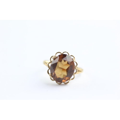 62 - 9ct gold rope framed citrine ring (2.4g) Size L