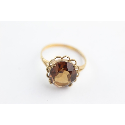 62 - 9ct gold rope framed citrine ring (2.4g) Size L