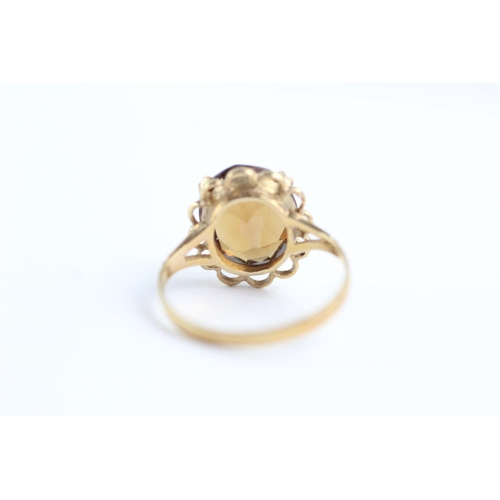 62 - 9ct gold rope framed citrine ring (2.4g) Size L