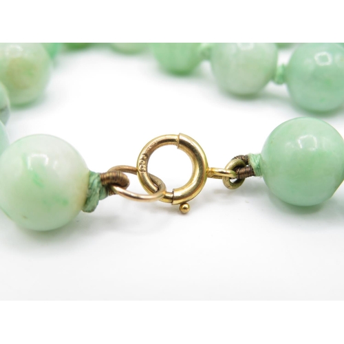 216 - 9ct gold clasped jade bead necklace (54.1g)