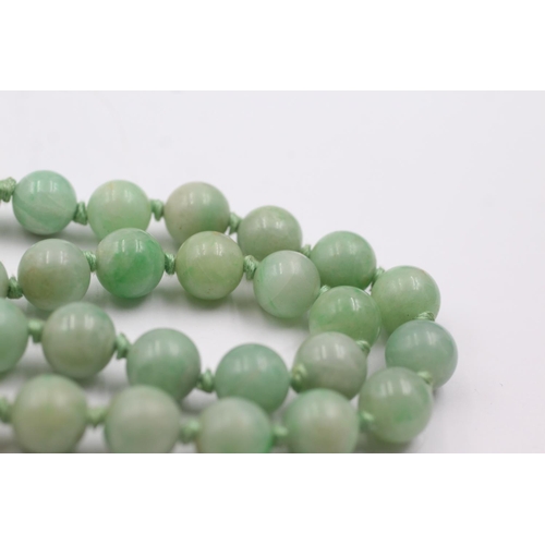 216 - 9ct gold clasped jade bead necklace (54.1g)