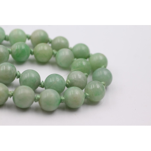 216 - 9ct gold clasped jade bead necklace (54.1g)