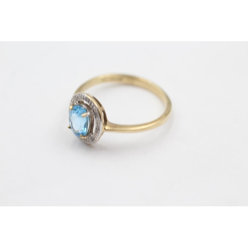 31 - 9ct gold diamond framed topaz ring (2g) size O