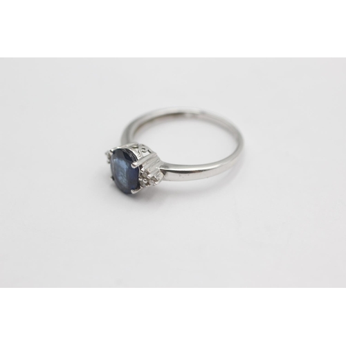 34 - 9ct white gold diamond and sapphire ring (2.4g) size P