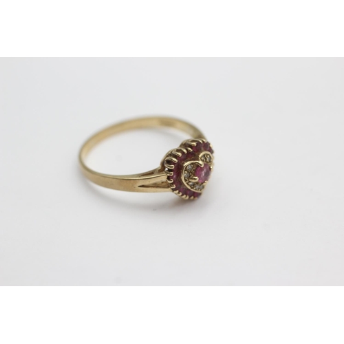 42 - 9ct gold diamond and ruby heart design ring (3.1g) size U