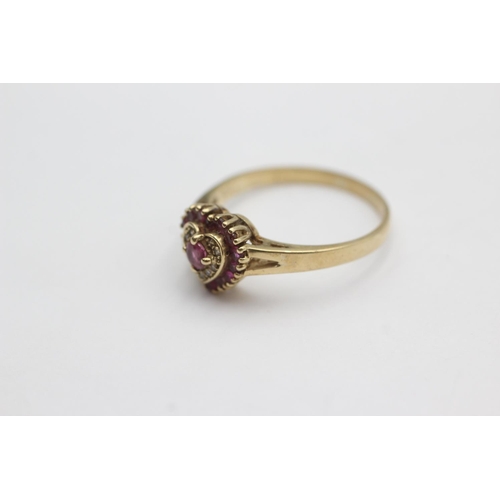 42 - 9ct gold diamond and ruby heart design ring (3.1g) size U