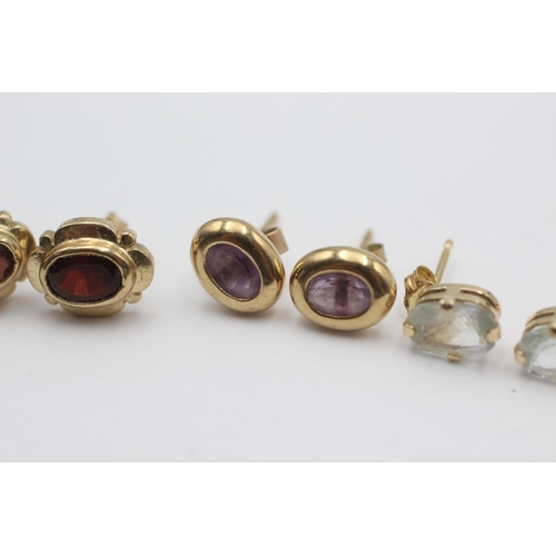 53 - 3 x 9ct gold paired gemstone stud earrings inc. amethyst, garnet & aquamarine (3.5g)