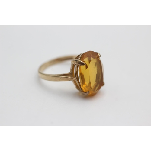 104 - 9ct gold orange paste cocktail ring (2.6g)  Size J