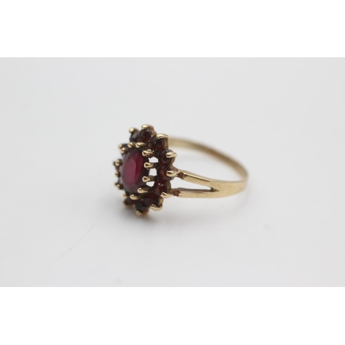 106 - 9ct gold garnet halo set ring (2.5g)  Size Q