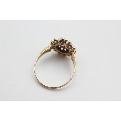 106 - 9ct gold garnet halo set ring (2.5g)  Size Q