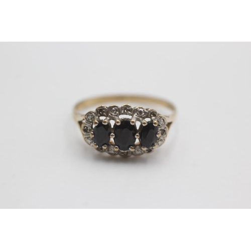 113 - 9ct gold diamond framed sapphire ring (2.5g)  Size S