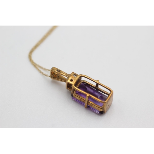 118 - 9ct gold framed amethyst pendant on chain (2.8g)