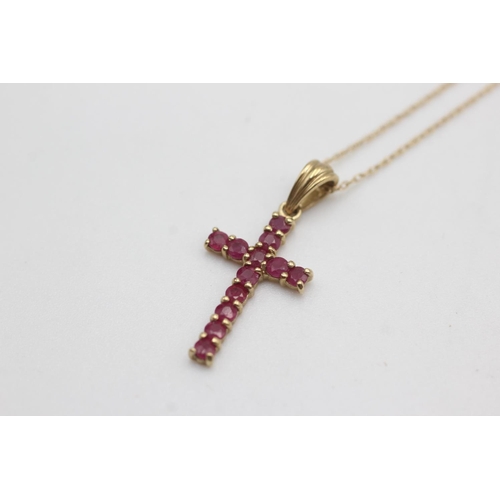 119 - 9ct gold ruby cross necklace (1.2g)