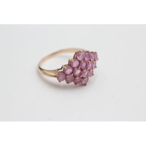 124 - 9ct rose gold pink sapphire cluster ring (3.8g)  Size S