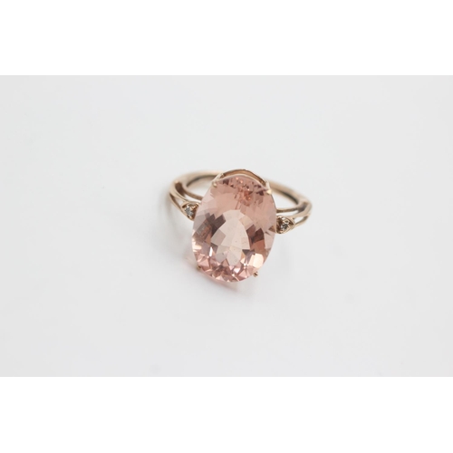 129 - 9ct rose gold diamond & rose quartz dress ring (4.1g)  Size Q