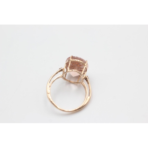 129 - 9ct rose gold diamond & rose quartz dress ring (4.1g)  Size Q