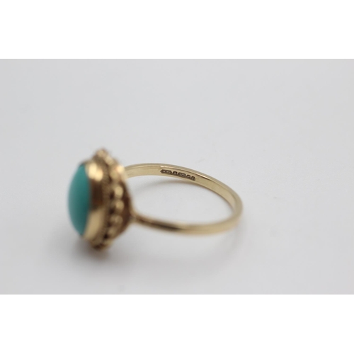 28 - 9ct gold rope framed turquoise ring (2.2g)  Size O