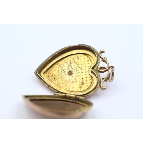 124 - 9ct gold back & front antique seed pearl & paste heart locket (6.2g)