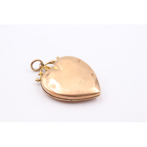 124 - 9ct gold back & front antique seed pearl & paste heart locket (6.2g)