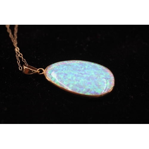 154 - 14ct gold framed opal pendant on chain (2.9g)